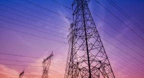 The silhouette of the evening electricity transmission pylon